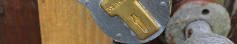 Section of a rusty old lock on a shed door