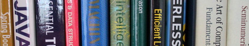 Close up of the covers of a number of books on AI, computer science, etc